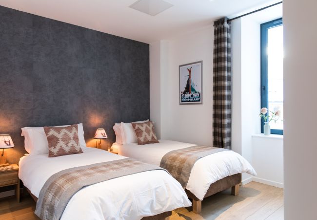 Chambre 2,  flexible avec un lit double ou deux lits simples  Chambre 2 de Chamois 2 est flexible avec un lit double ou deux lits simples