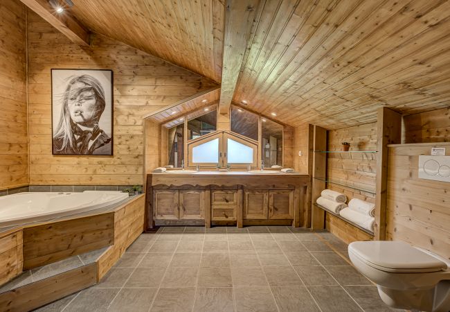 Impressive ensuite to Bedroom 1 with corner bath  Chalet Sanaz has an impressive ensuite to Bedroom 1 with a corner bath