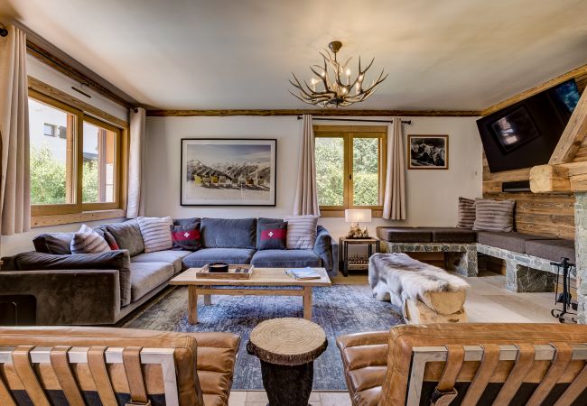 Large, wall-mounted TV  Chalet Sanaz has a large, wall-mounted TV