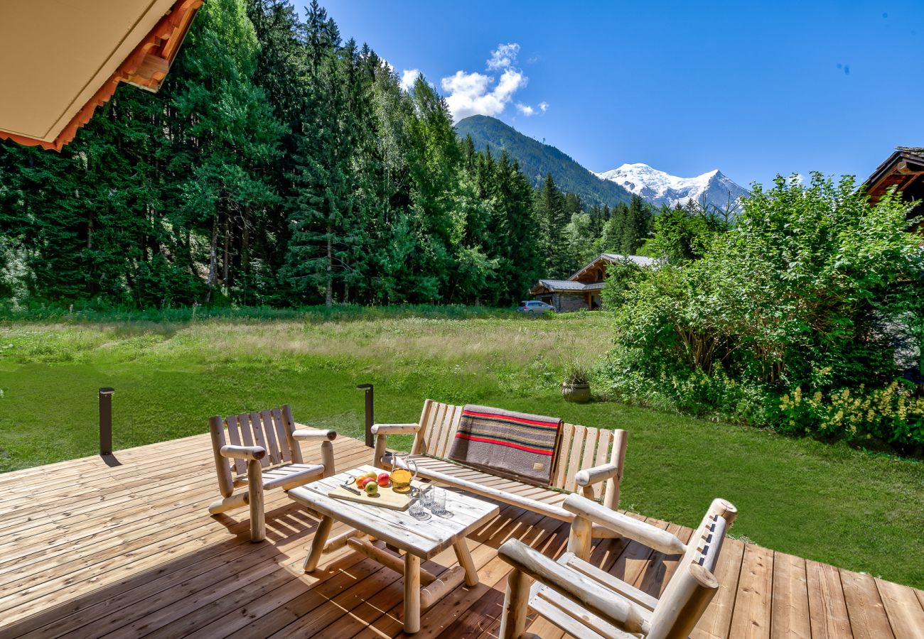 Sunny deck opening onto garden and then open ground Chalet Sanaz has a sunny deck opening onto the garden and then open ground