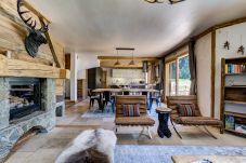 Chalet Sanaz has an open plan living area with a log burner       