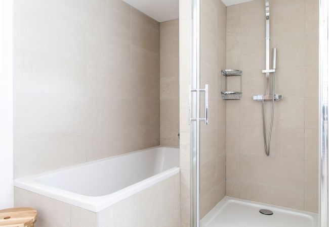 Bathroom has both bath and separate shower  The bathroom of Chamois 1 has a bath and a separate shower