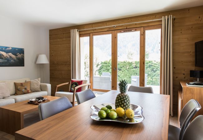 Dining table in front of glass doors to terrace  Villa Floria has a dining table in front of glass doors on to the terrace